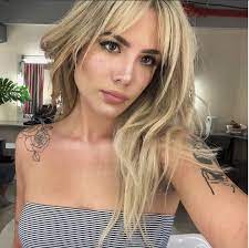 Halsey sports long blonde waves with a dark lipstick shade. Halsey Shut Down Trolls Who Said Her Real Hair Was A Wig
