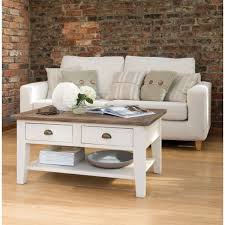 This coffee table with shelves offers a useful resting place for remotes, magazines, snacks and so much more. Watson Coffee Table Painted Living Room Furniture