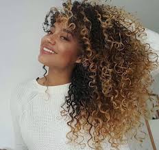 An ombre for curly hair is a coloring technique for naturally curly hair that features a darker shade at the roots then gradually becomes lighter as it goes down to the ends. 13 Hair Dye Ideas Hair Curly Hair Styles Curly Hair Styles Naturally