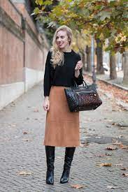 The pearl oyster is wearing a. Suede Skirt Dolman Sweater Camel Midi Skirt Knee High Boots Meagan S Moda
