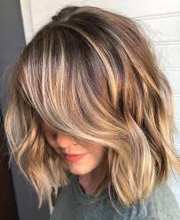 This sweet hourglass shape is created from medium to long layers that flip out. Gorgeous Brown Hairstyles With Blonde Highlights Hair Styles Textured Haircut Brown Hair With Blonde Highlights