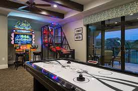 Take Your Pick Of Skee Ball Air Hockey Basketball Racing And More In The Game Room Small Game Rooms Home Cinema Room Arcade Room
