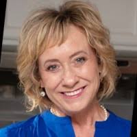 At the closing table with both Sellers and Buyers (seated).