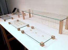 Elevated Flat Glass With Small Blocks Of Wood Jewelry Display Wood Jewelry Display Minimalist Jewelry Display Jewellery Display