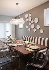 This chic dining room has brown floral patterned cushions on the dining chairs matching the floral patterned area rug that contrasts the hardwood flooring. Grey Brown Dining Room Houzz