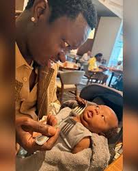 Michael Blackson and his son 👶🏾 The baby's face says it all: “You really  gonna eat that without me, dad?” 😳😂