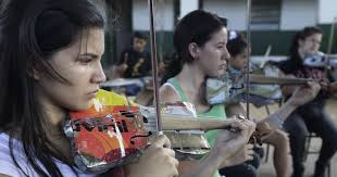 A way out of the landfill': Paraguay kids play Mozart with violins made  from trash