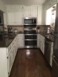 sw alabaster cabinets, dark granite