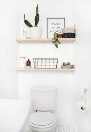 Cut some boards stain them and put them on simple white brackets. Diy Bathroom Shelves The Merrythought