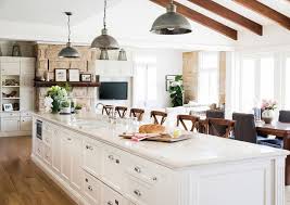 The white cabinets and white stone bench match the rest of the kitchen, while the dark timber panelling matches the flooring and adds a rustic touch. Long Kitchen With Island Whaciendobuenasmigas