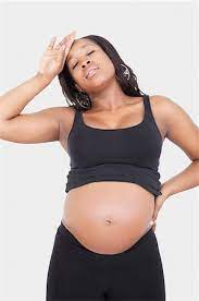 Pregnant Woman Front View With Hands On Belly Stock Photos Page 1 Masterfile
