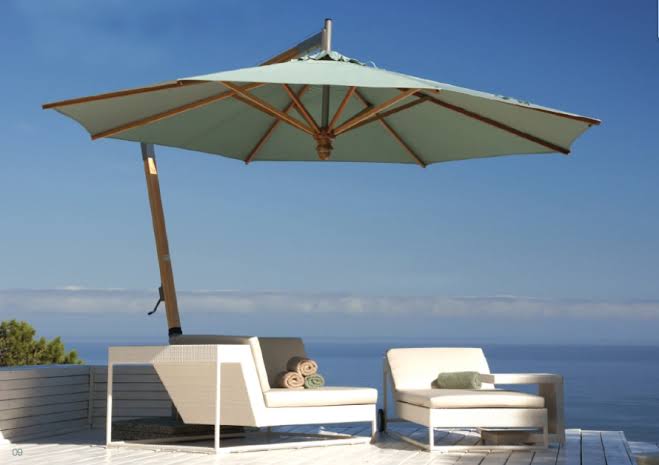 Quality outdoor garden umbrellas shade patios during intense midday sun, AI generated
