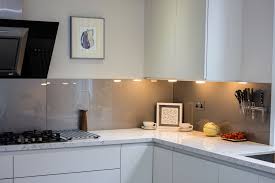 Priming walls and applying a final coat of paint. Glass Splashbacks For Your Kitchen