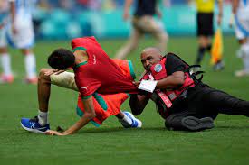 Fans storm pitch and throw bottles as Argentina v Morocco descends into chaos to kick off Olympics | The Independent