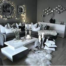 A range of undertones in inviting textures in neutral tones adds comfort and style to this living room, proving that shades of the white base to this room allows it to remain bright and lively, while the grey tones make it livable. Black White And Silver Living Room Decor Home Decoration Design Ideas