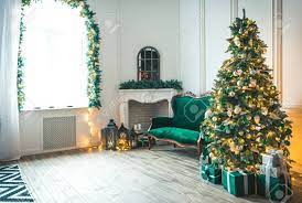 Nice living room backgrounds christmas. Christmas Living Room With A Fireplace Sofa Christmas Tree And Gifts Beautiful New Year Decorated Classic Home Interior Winter Background Stock Photo Picture And Royalty Free Image Image 89684212
