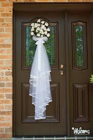 Flowers On The Front Door For The Wedding Day Bridal Shower Decorations Wedding Door Decorations Bridal Shower Veil