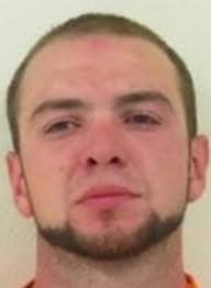 Felon with violent past surrenders to police in Buxton