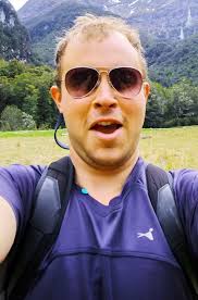 Daredevil tourist stands just feet away from steaming LAVA flow to get a  perfect shot