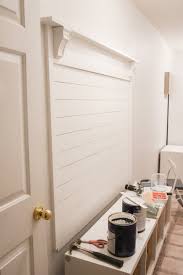 It features 4 cubbies on top and 4 cubbies on the bottom with a half shelf in each one so you can fit boots. Diy Shiplap Hall Tree With Bench The Frugal Homemaker