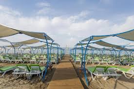 Inn square complete with firepit, fountain, rocking chairs, oversized chess and corn hole. Senza The Inn Resort Spa Avsallar Turkey Booking Com