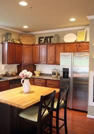 However, there are ways to deconstruct it and use it as a functional or decorative (or both) space. Decorating Over Cabinets Great Ideas And Tips I Have No Clue What To Put Up There Decorating Above Kitchen Cabinets Kitchen Cabinets Decor Home