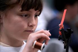 Learning to tie the cinder worm fly at Kettle Pond workshop.