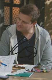HOLLYOAKS* KAI OWEN 'PETE BUCHANAN' SIGNED 6x4 ACTION PHOTO+COA
