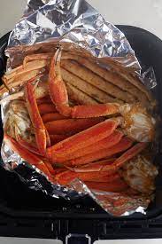 The Cooked Crab Legs On Foil In The Air Fryer Basket Air Fryer Dinner Recipes King Crab Legs Recipe Air Fryer Recipes Easy