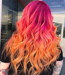The ombre color goes from a bright pink root color to a warm but light shade of blonde at the ends. How To Get Pink Ombre Hair 17 Cute Ideas For 2021 Sunset Hair Creative Hair Color Hair Inspiration Color