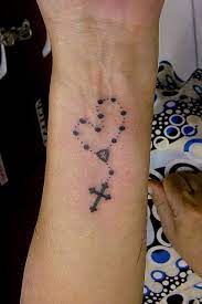 A host of symbolic and sacred tattoos here at design cute small tattoo backed with motivation of faith combined with a cross with beaded rosary. Pin On Tatt Tatt Tatted Up