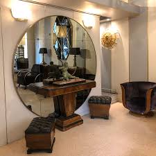 Smoked glass is glass held in the smoke of a candle flame (or other inefficiently burning hydrocarbon) such that one surface of the sheet of glass is covered in a layer of smoke residue. Rounded Brass Frame And Smoked Glass 70 Diam Mirror Window Look Pescetta