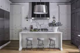 White And Grey Kitchen Waterfall Island Metal Hood Painted Cabinets Medium Brown Wo Grey Kitchen Cupboards Grey Kitchen Cabinets Traditional Kitchen Design
