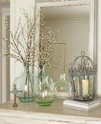 Learn how to decorate creatively with these easy repurposing ideas to spruce up your home for use a glass jar as a vase, group ottomans as a coffee table, or try a pretty basket to hold a plain planter. Christine Fife Interiors Design With Christine Decor Willow House Home Decor