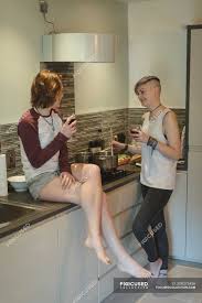 This hot german girl, knows how to cook her dinner in style. Young Women Having Wine While Cooking In Kitchen At Home Relationship Casual Clothing Stock Photo 209275436