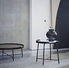 The glass surface keeps the form light, modern, and helps to keep the room looking spacious. Contemporary Coffee Table Wire Dare Studio American Walnut Natural Oak Wire