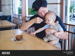 father feeding food image photo free trial bigstock