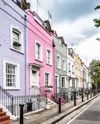 A Row Of Colorful Houses In London S Chelsea Purple Pink Green And Yellow All Figure In House Chelse London Places Best Places In London Pastel House