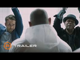 What was the first trailer to time percussive gunshots and explosion noises to the music? The Hitman S Wife S Bodyguard Movie Tickets And Showtimes Near Me Regal