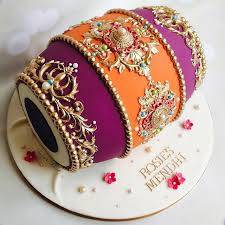 Last Week I Had The Pleasure Of Making A Dholki Cake For The Groom A Gift From The Brides Family And Thi Mehndi Cake Mehndi Decor Bride And Groom Cake Toppers