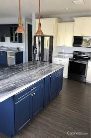 This kitchen shows blue on the base cabinets and wood on the upper cabinets. Check Out This Nautical Inspired Kitchen Using Our Baldwin Naval Alabaster Cabinets Online Kitchen Cabinets Kitchen Inspirations Kitchen Design