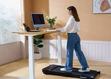Under-desk walking pads provide a seamless way to stay active during office hours., AI generated