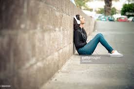 Leaning against wall pose drawing. Teenage Girl Leaning Against Wall Listening Music With Headphones Picture Id634475723 1 024 682 Pixels Drawing Poses Pose Reference Poses