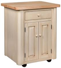 A kitchen island stands away from the normal counter space. Bergen Place Kitchen Island Countryside Amish Furniture
