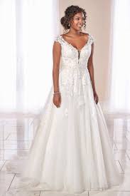 Strapless blush wedding dress with a ruffled skirt. Wedding Dresses In Cardiff At Laura May Bridal Plus Size