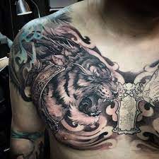 Grey Ink Roaring Tiger Tattoo On Man Chest Tattoos Tiger Tattoo Cool Chest Tattoos
