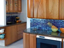 Some kitchens use a combination, but i prefer sticking with one material a country kitchen with a light blue island and multicolored ceramic tiles for the backsplash. Kitchen Cool With Glass Tile Backsplash Luxury Comforter Bedspread
