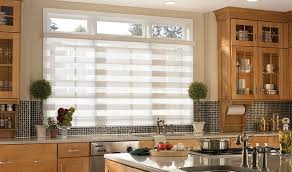 Photo about modern bright kitchen interior with white horizontal window blinds, wooden cabinets with white countertop and household appliances. 5 Modern Kitchen Window Treatments To Replace Old Curtains