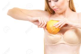 Young Woman Small Boobs Puts Big Fruit Grapefruit In Her Bra. Breast  Enlargement Size Correction Concept. Stock Photo, Picture and Royalty Free  Image. Image 144317487.