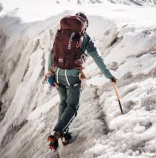 glacier with crampons and an ice axe ...